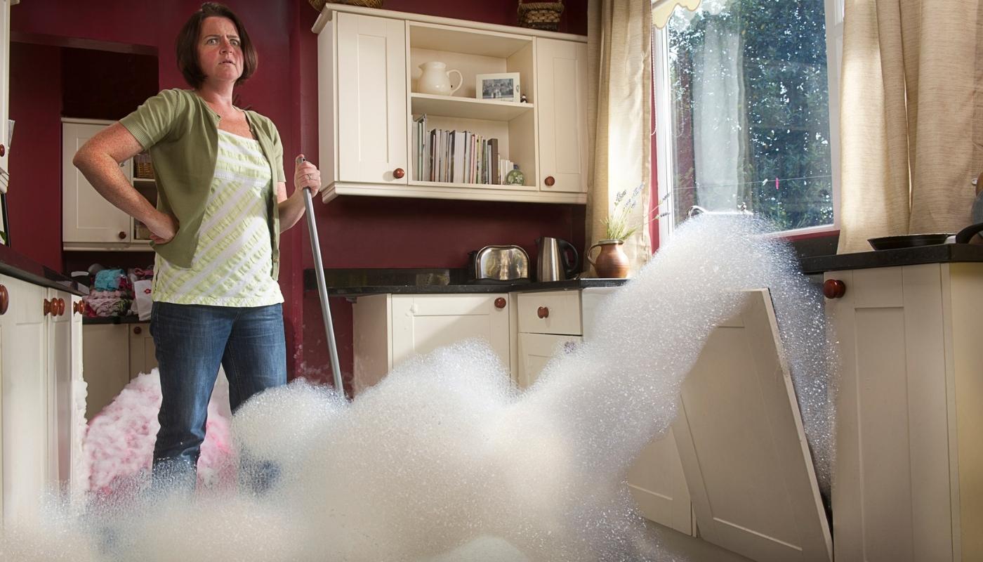 woman upset about broken dishwasher