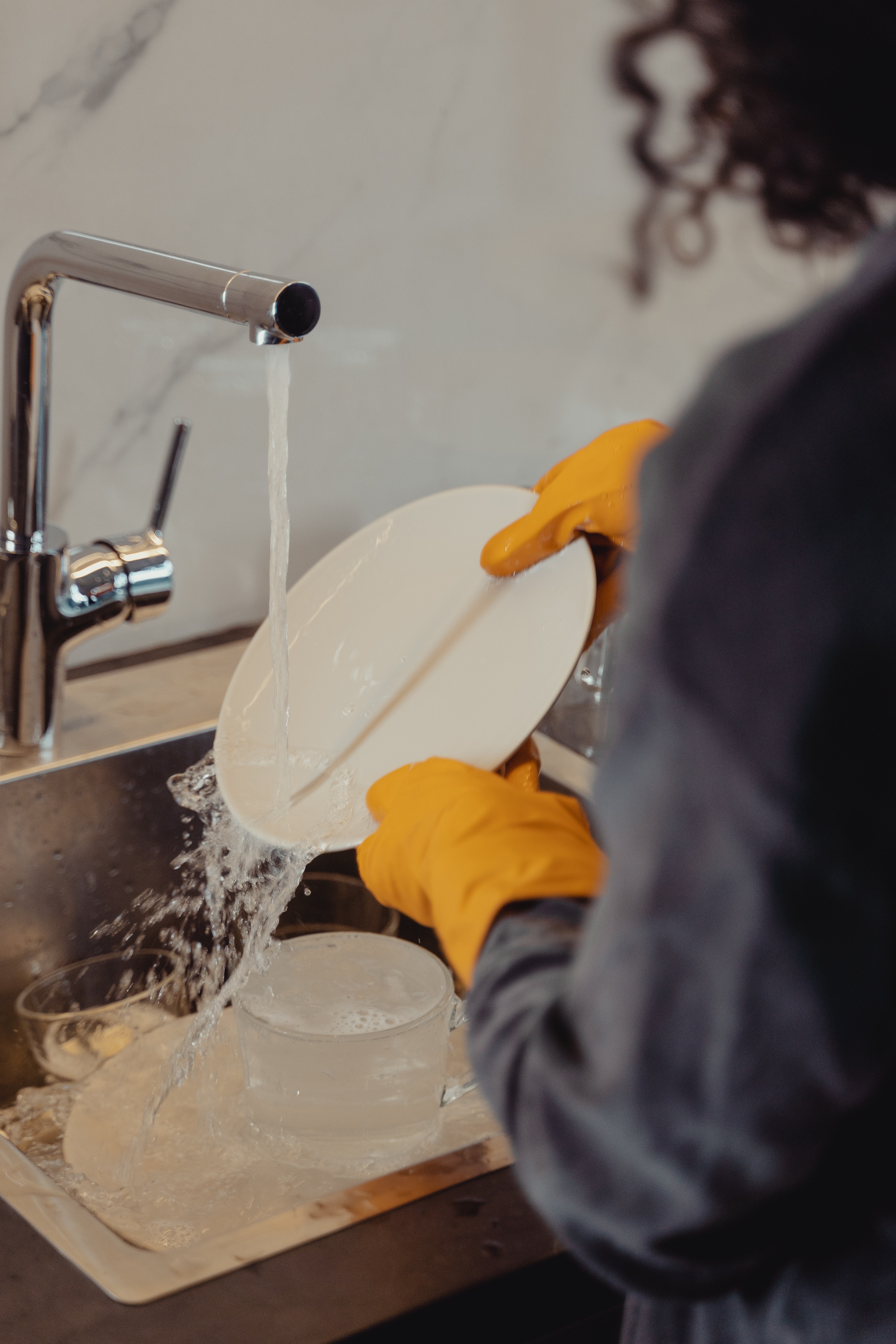 person handwashing dishes