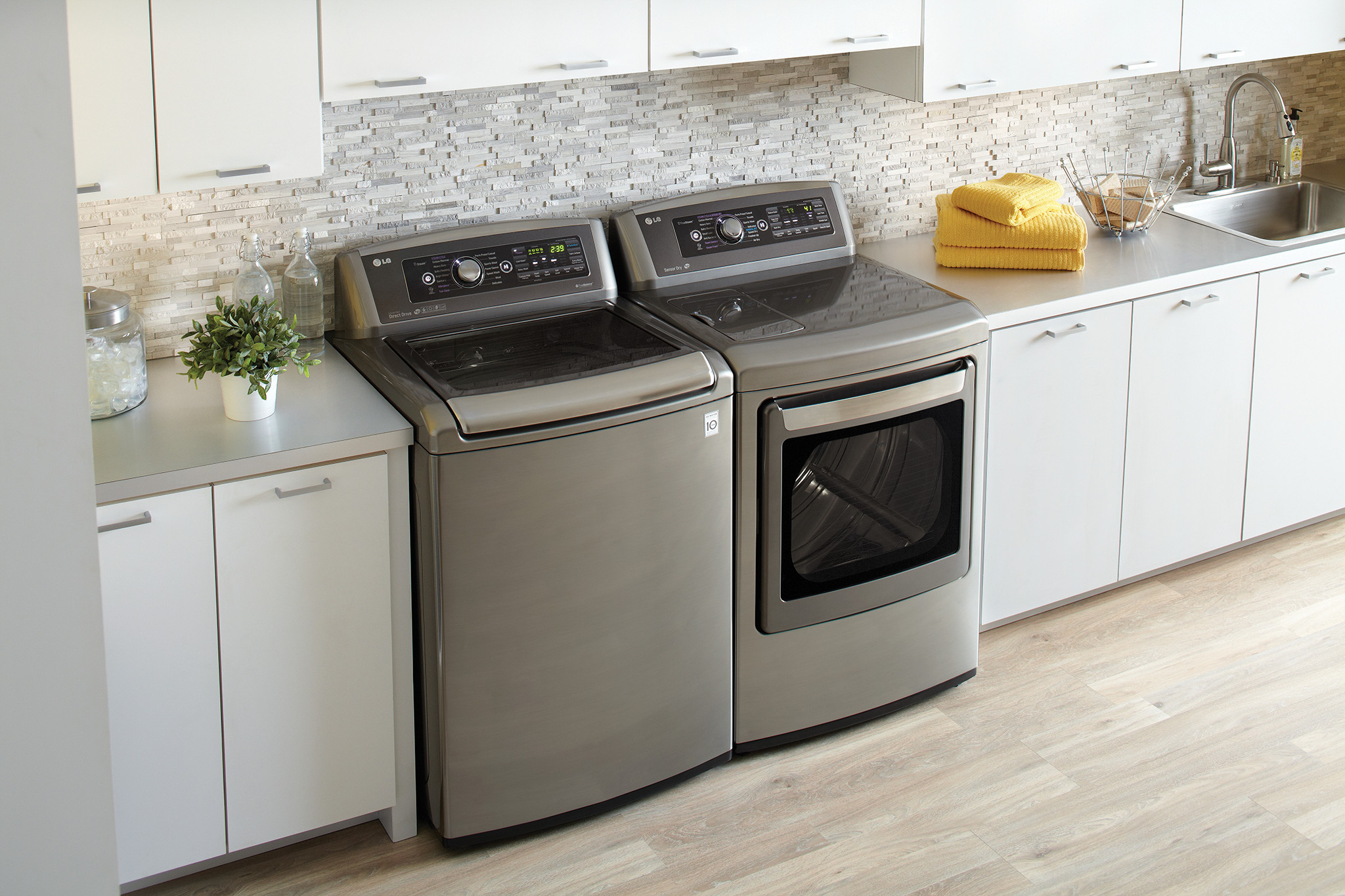lifestyle image of top load washer and front load dryer