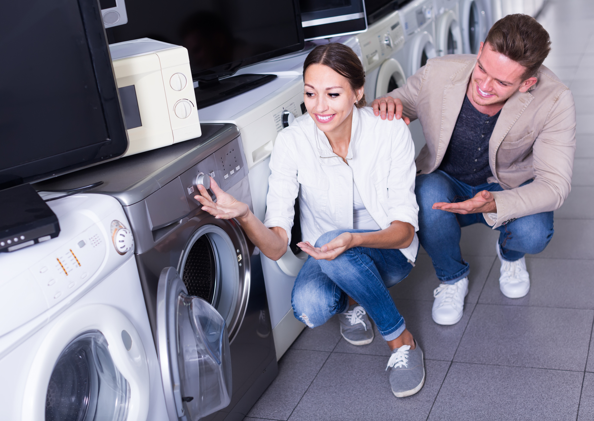 man and woman looking for a dryer in store