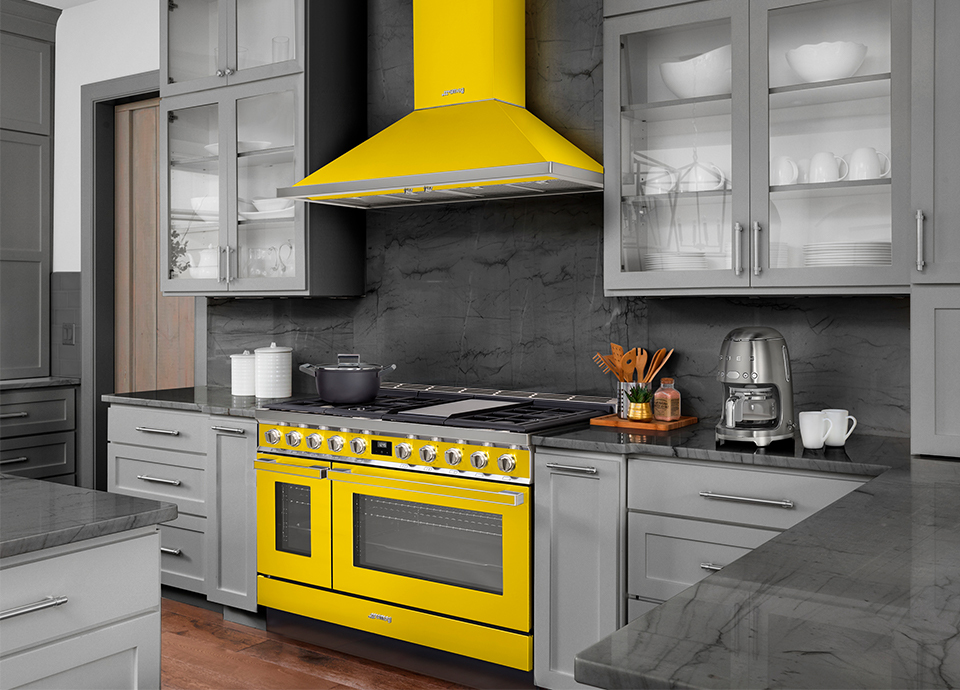 Yellow Smeg appliances in gray kitchen