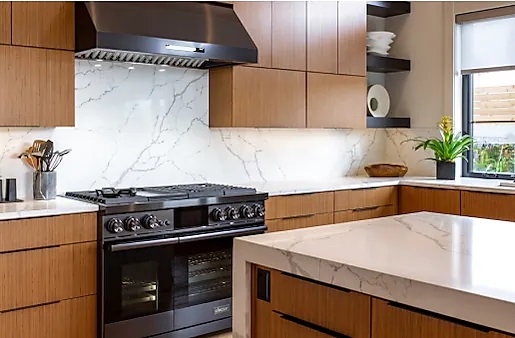 Black Dacor appliances in all dark wood kitchen
