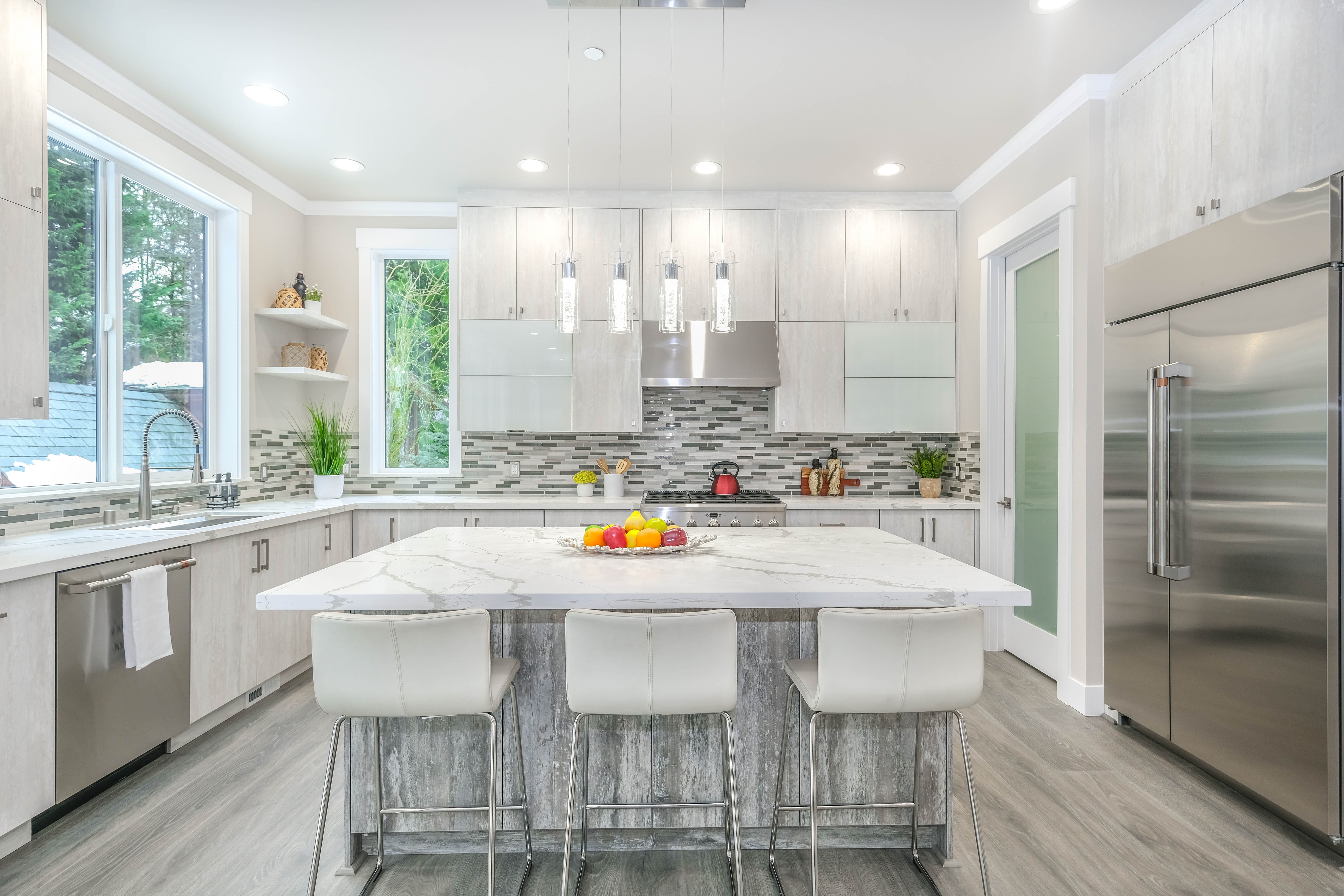 modern kitchen with stainless steel side by side fridge