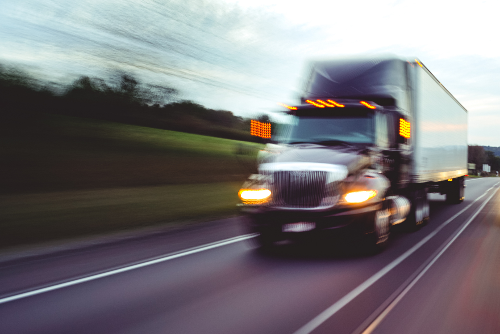 motion blur semi-truck driving quickly