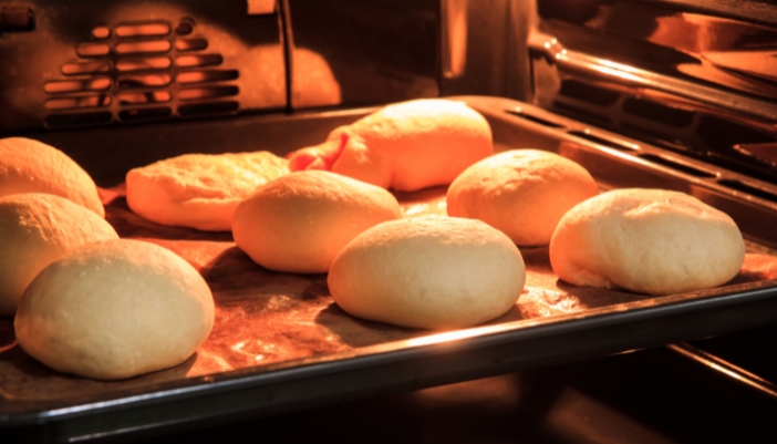 Closeup of bread baking in a gas wall oven
