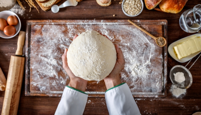 Closeup of a perfectly shaped and kneaded ball of dough