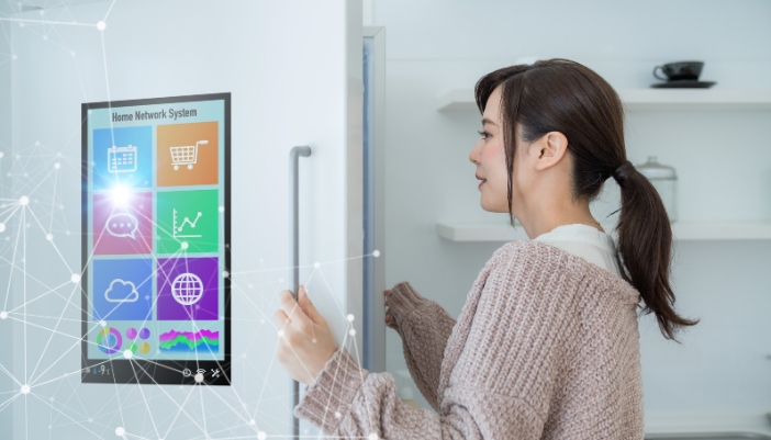 Woman opening up smart fridge
