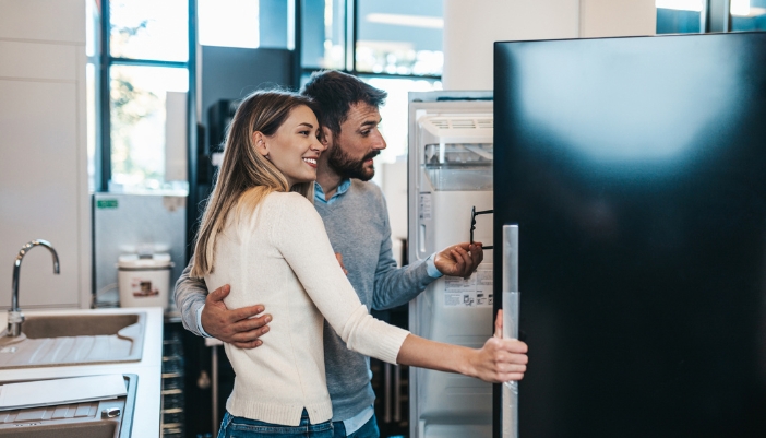 A couple shopping for appliances