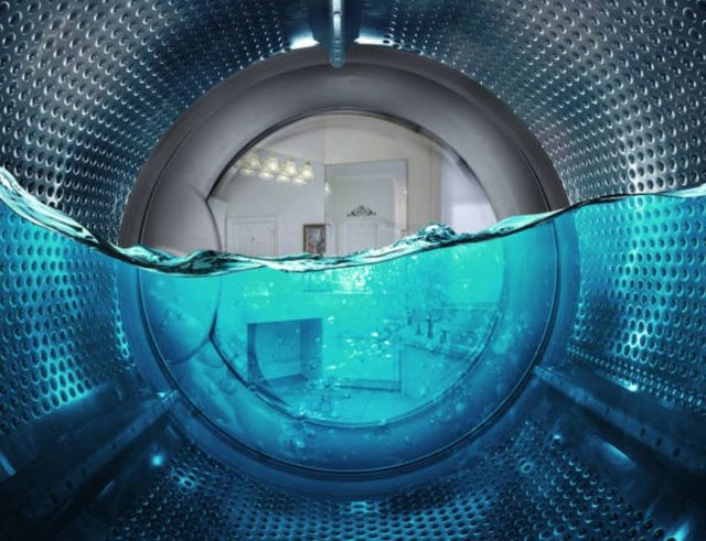 view of washing machine full of water from the inside. Credit: urfinguss