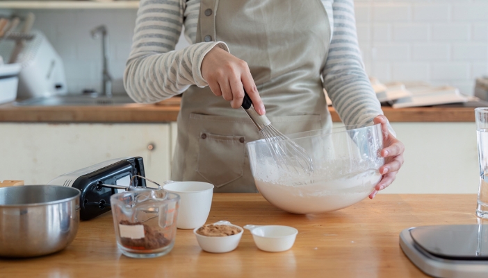 Closeup of someone prepping their ingredients for making a cake
