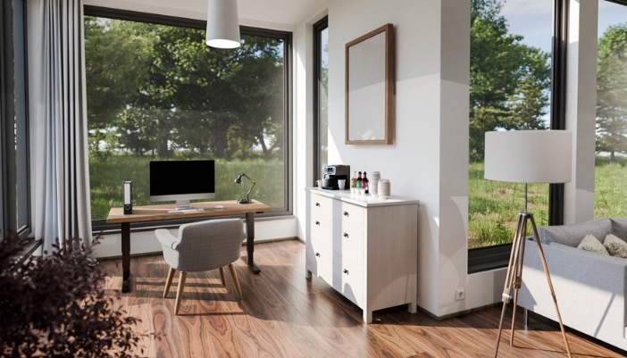  home office with a large window in front of the desk and a coffee station to the right.