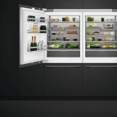 A pair of Fisher & Paykel built in refrigerator with black custom panels