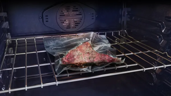 A steak cooking with the Samsung NV51CG700SSR sous vide feature 