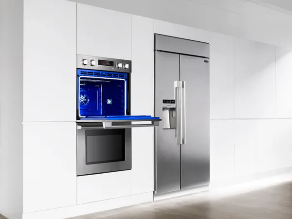 The Signature Kitchen Suite UPWD3034ST oven with a matching Signature Kitchen Suite refrigerator 