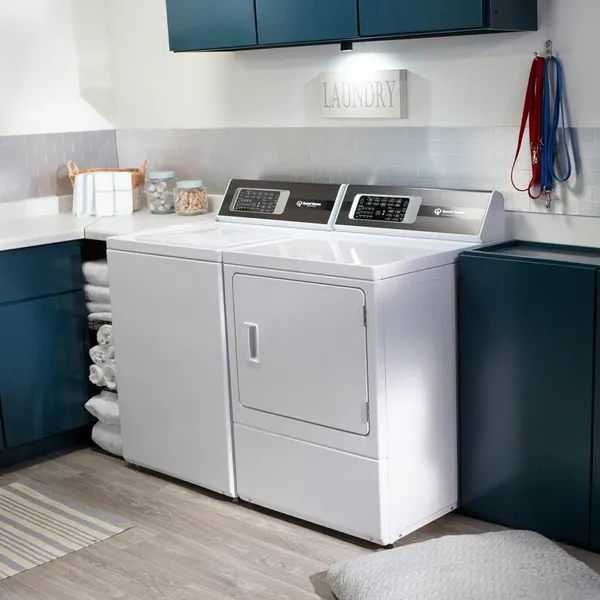 The Speed Queen DR7004WE dryer and washer in a laundry room 