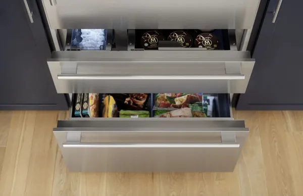 An overhead look at open Thermador Freedom T36BB110SS refrigerator drawers 