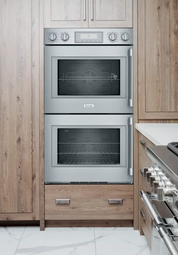 The Thermador Professional POD302LW oven installed in wooden cabinetry 