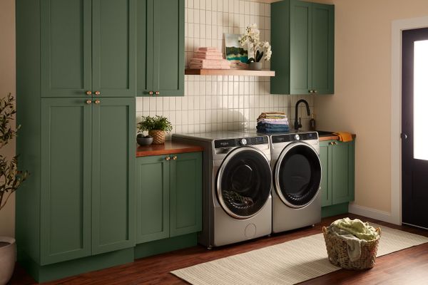 The Whirlpool WFW5720RR washer and dryer pair in a laundry room 
