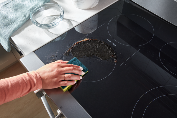An overhead view of a Whirlpool WipeClean range being cleaned