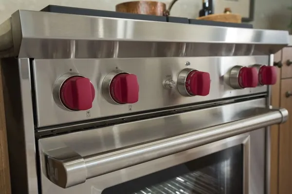A close-up of the Wolf GR304 range knobs 