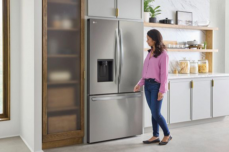 Woman About to Open Refrigerator