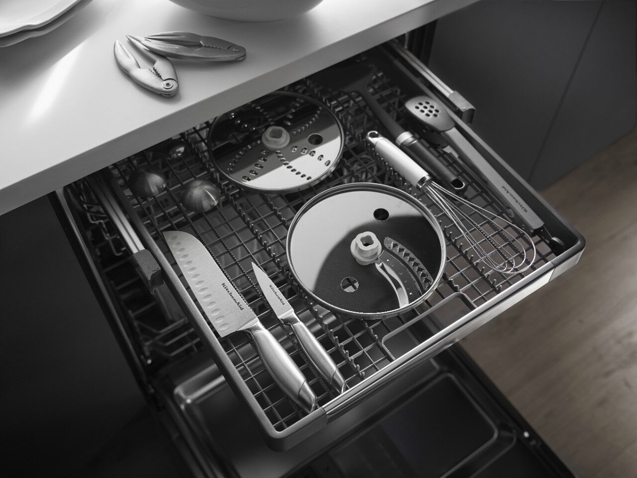 A woman opening an Amana dishwasher 