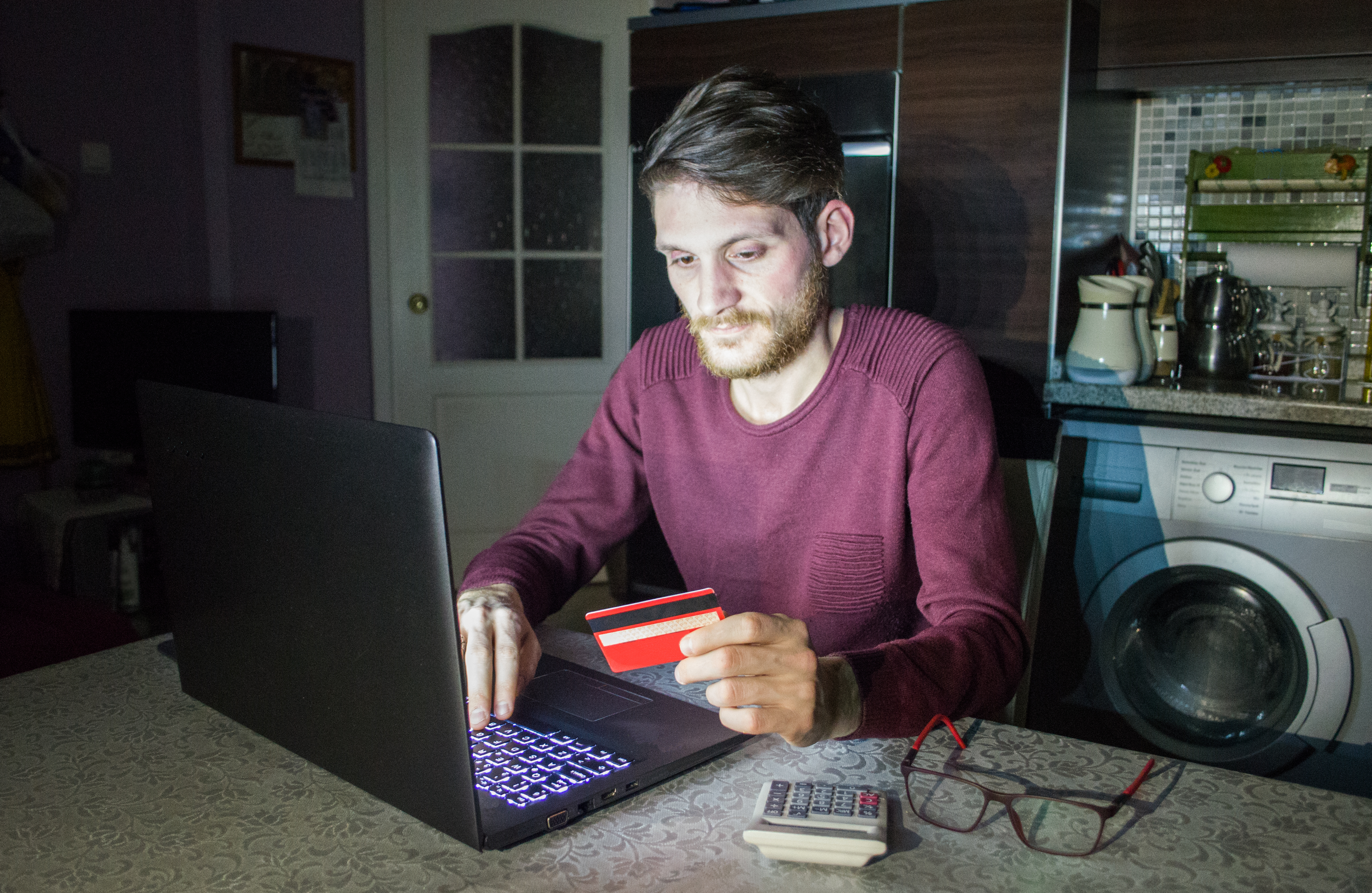 Man using credit card to shop online 