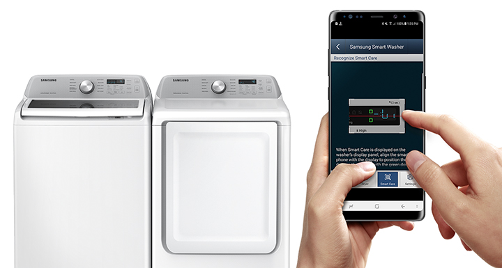 A person programming a Samsung smart washer and dryer from a smart device 