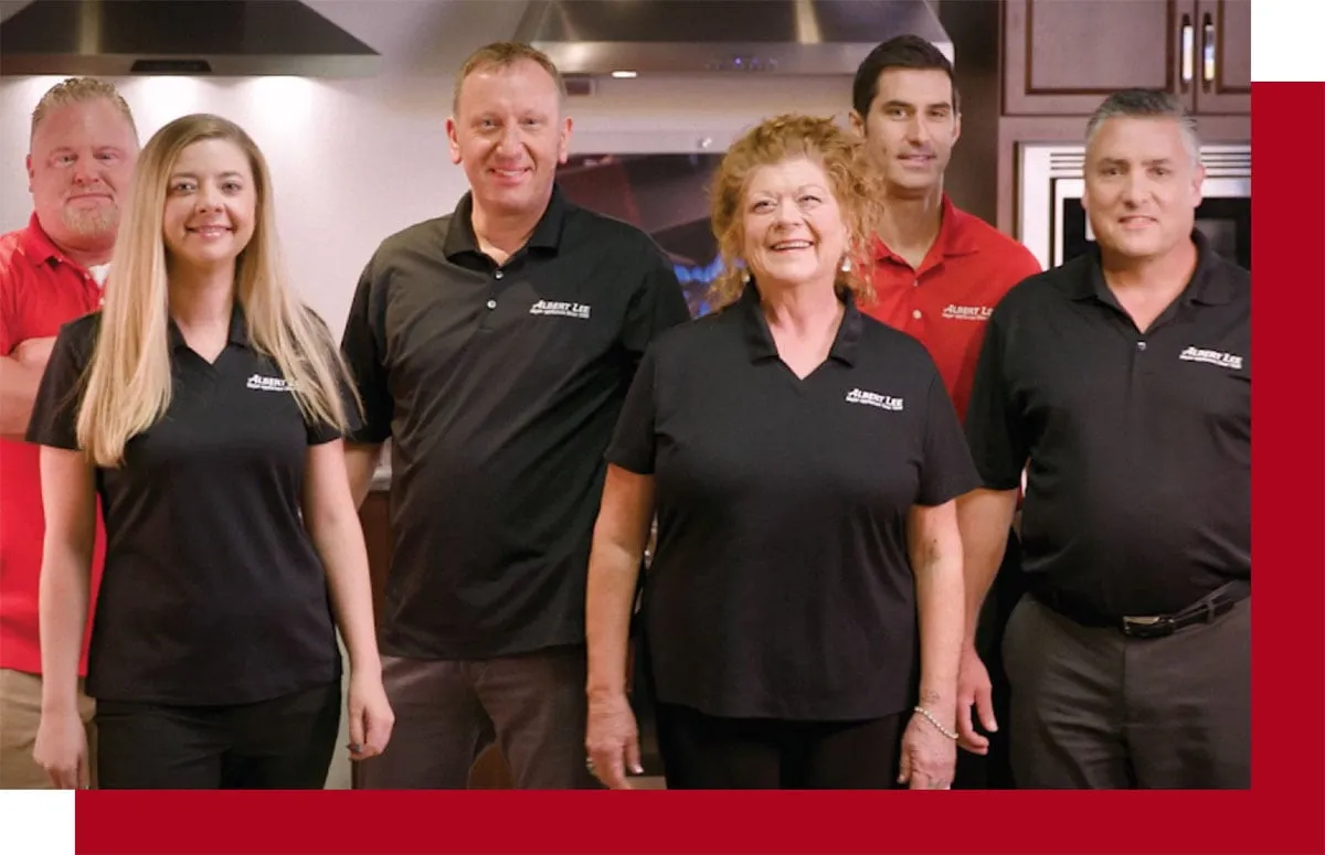 Albert Lee staff members smiling for a picture 