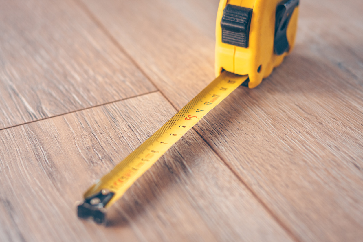 A tape measurer on a wooden surface