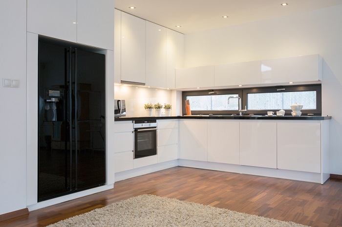 Close-up of black fridge in bright kitchen