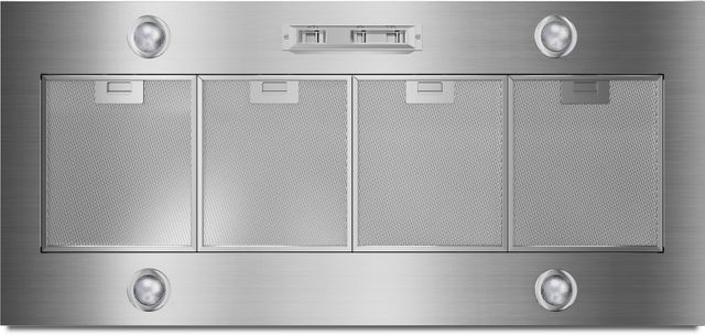 tock image of a stainless steel Whirlpool brand range hood insert with four vents and LED lights. 