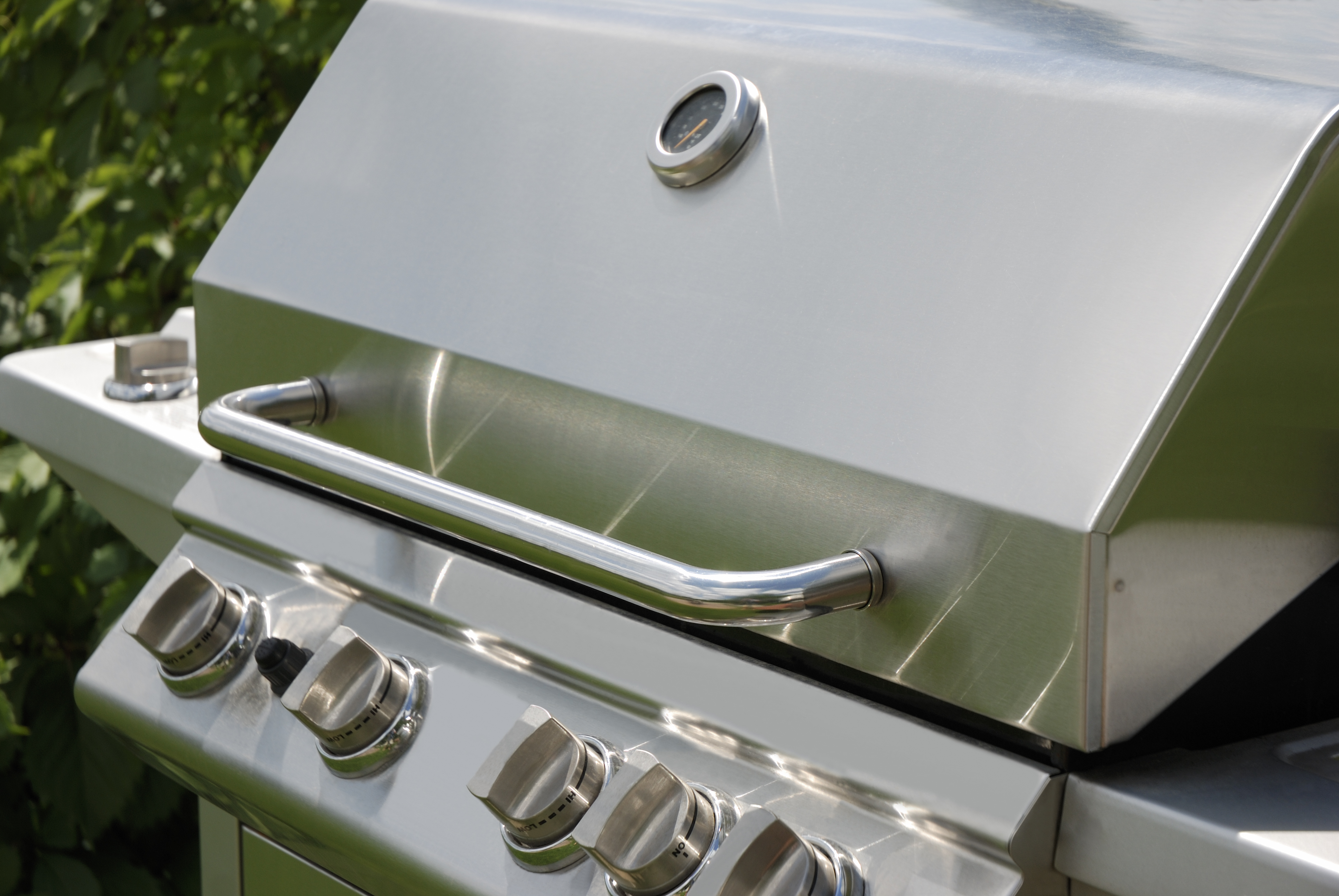 Close up look at a freestanding stainless steel grill 