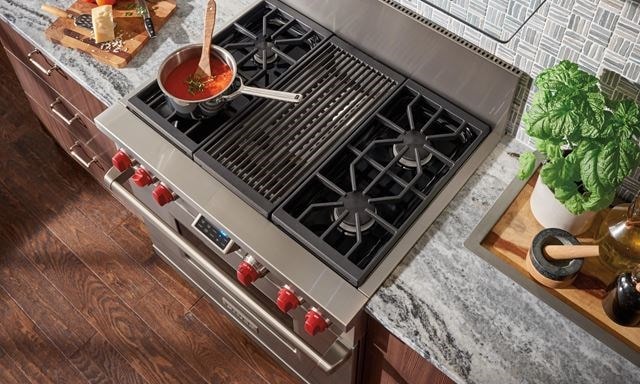  A Wolf 48” professional range showcased in a kitchen 