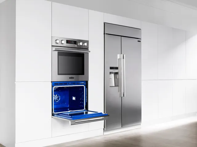 A Signature Kitchen Suite 30” double wall oven with its bottom door open