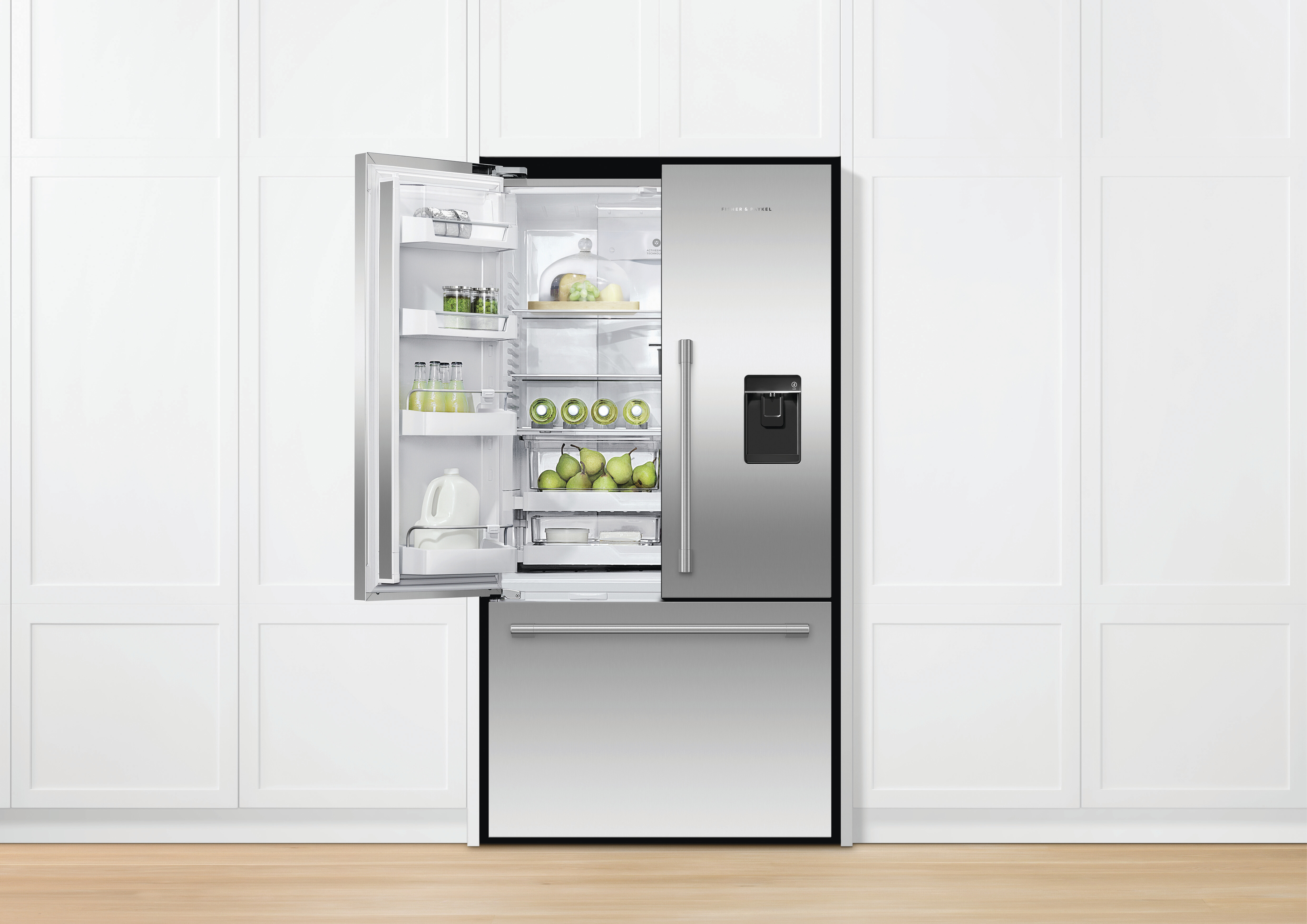 A Fisher & Paykel built-in French door refrigerator with one door open 