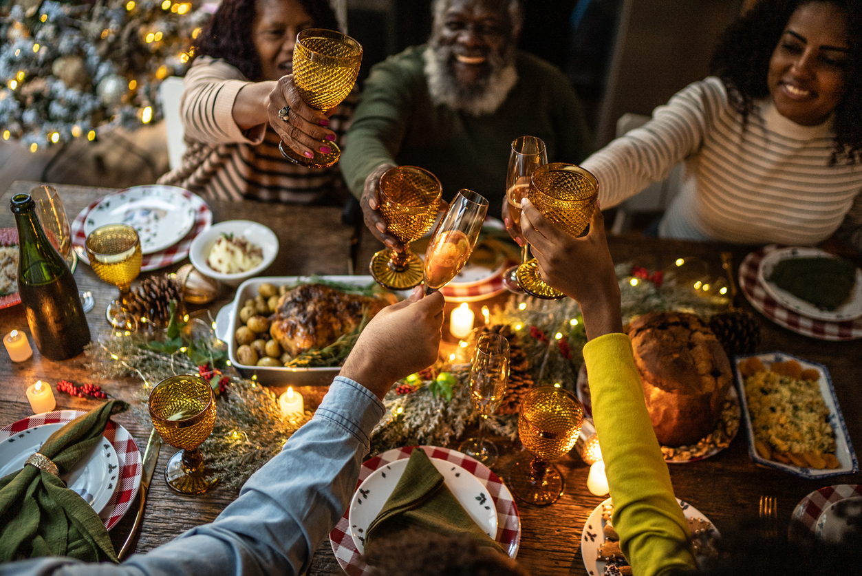 family toasting on Christmas dinner at home