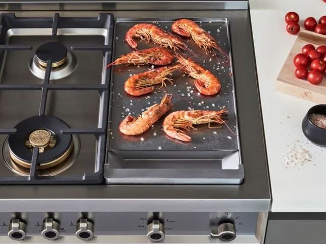 front close view of prawns cooking on a bertazzoni range flattop