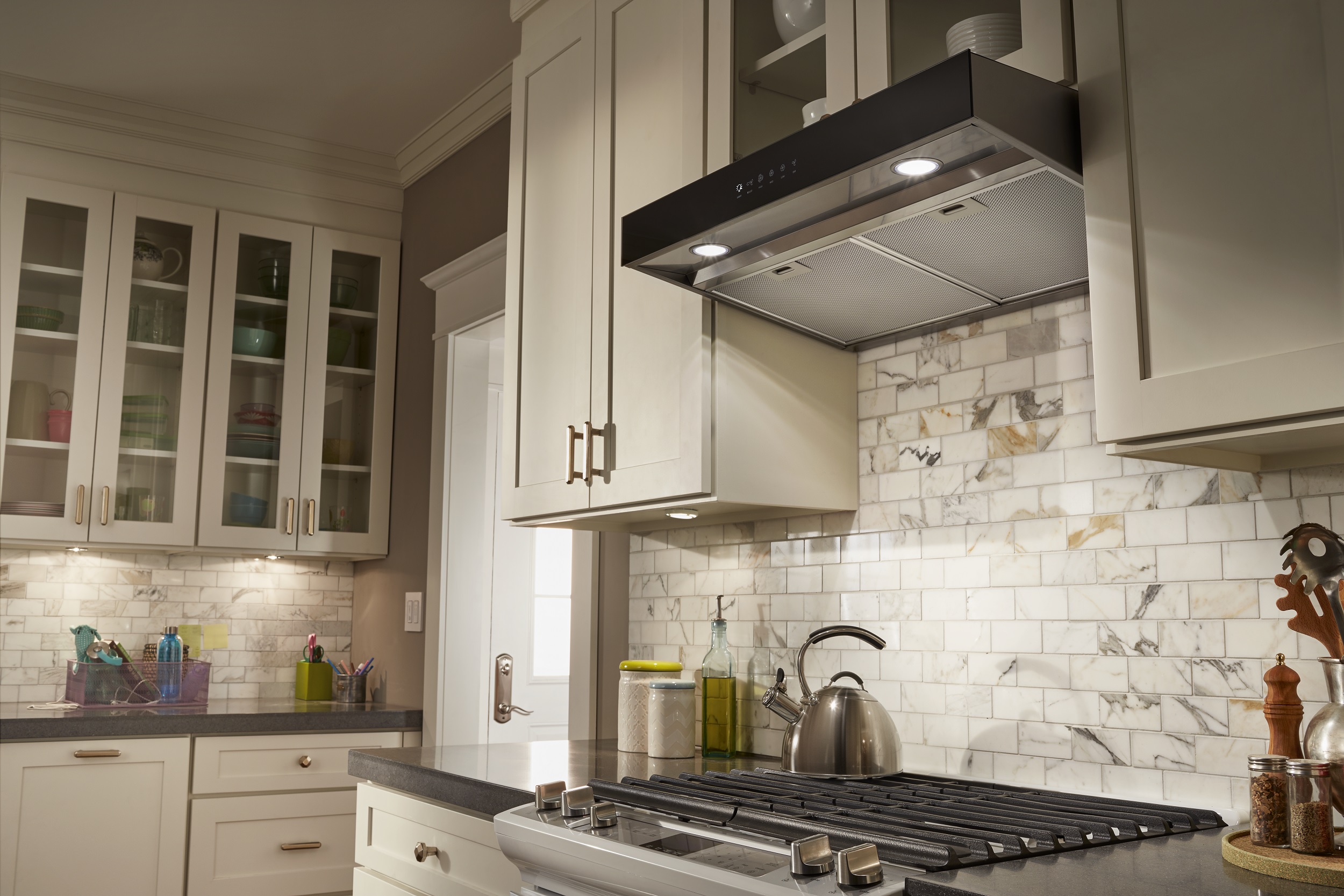 Under cabinet range hood in a kitchen