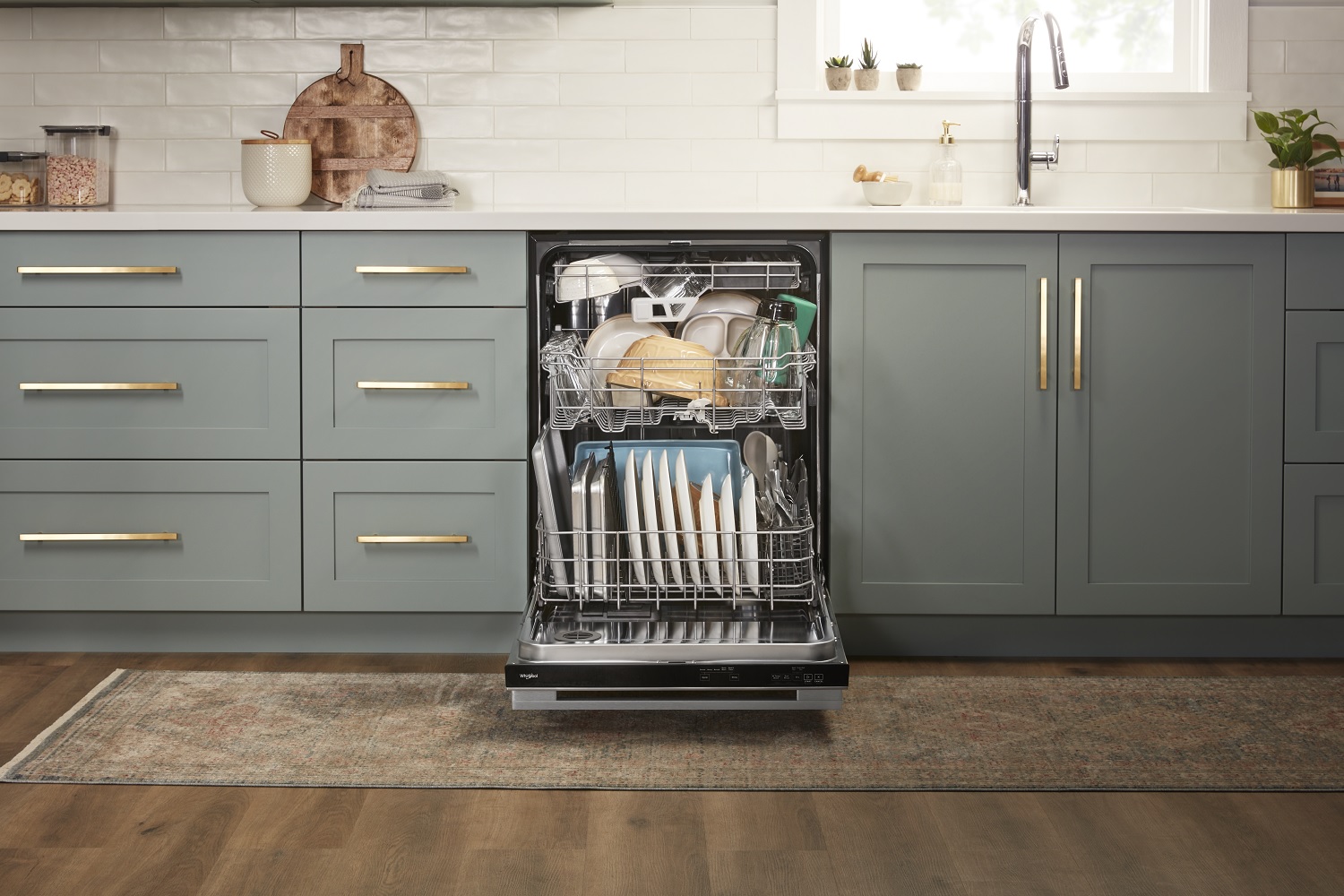 KitchenAid dishwasher reveals three racks of clean dishes