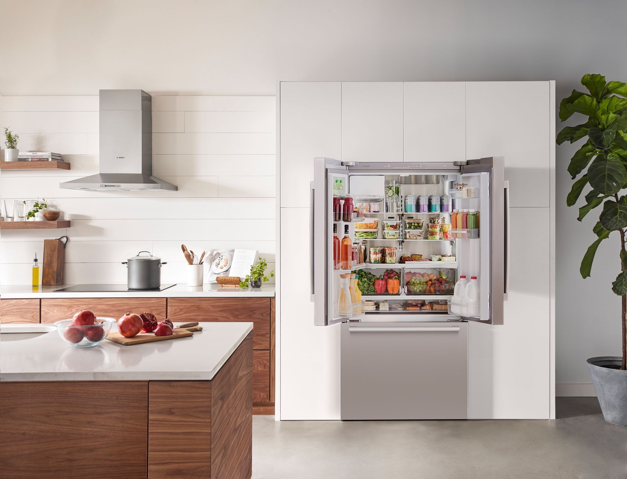 opened Bosch French door refrigerator in modern kitchen