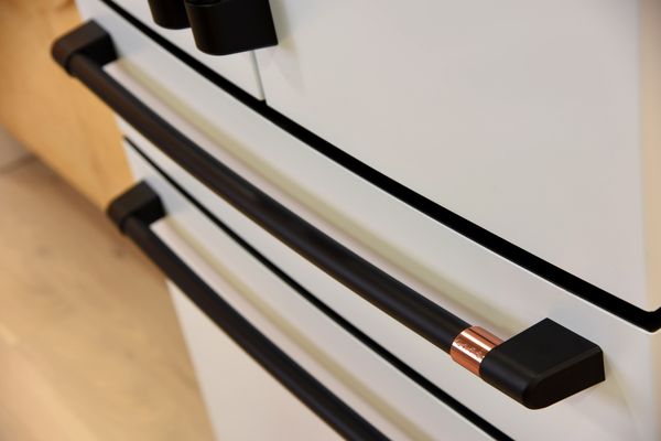 A close-up look at custom hardware on a Café refrigerator