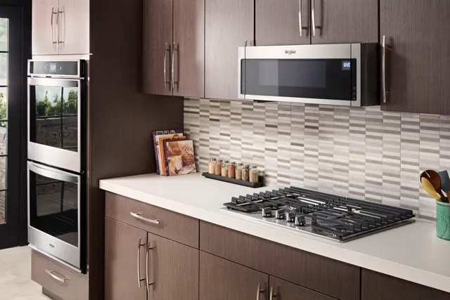 The Whirlpool WML55011HS over the range microwave featured in a modern kitchen 