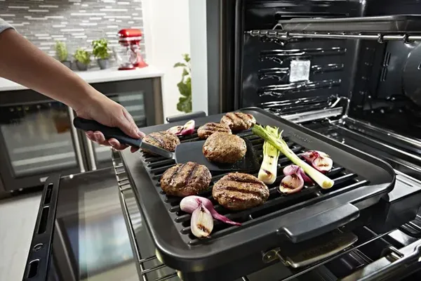 A close-up of the KitchenAid Smart Grill attachment on a KitchenAid smart oven 