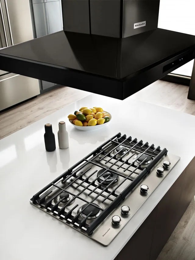 A overhead look at the KitchenAid KVIB606DBS black range hood over a cooktop 