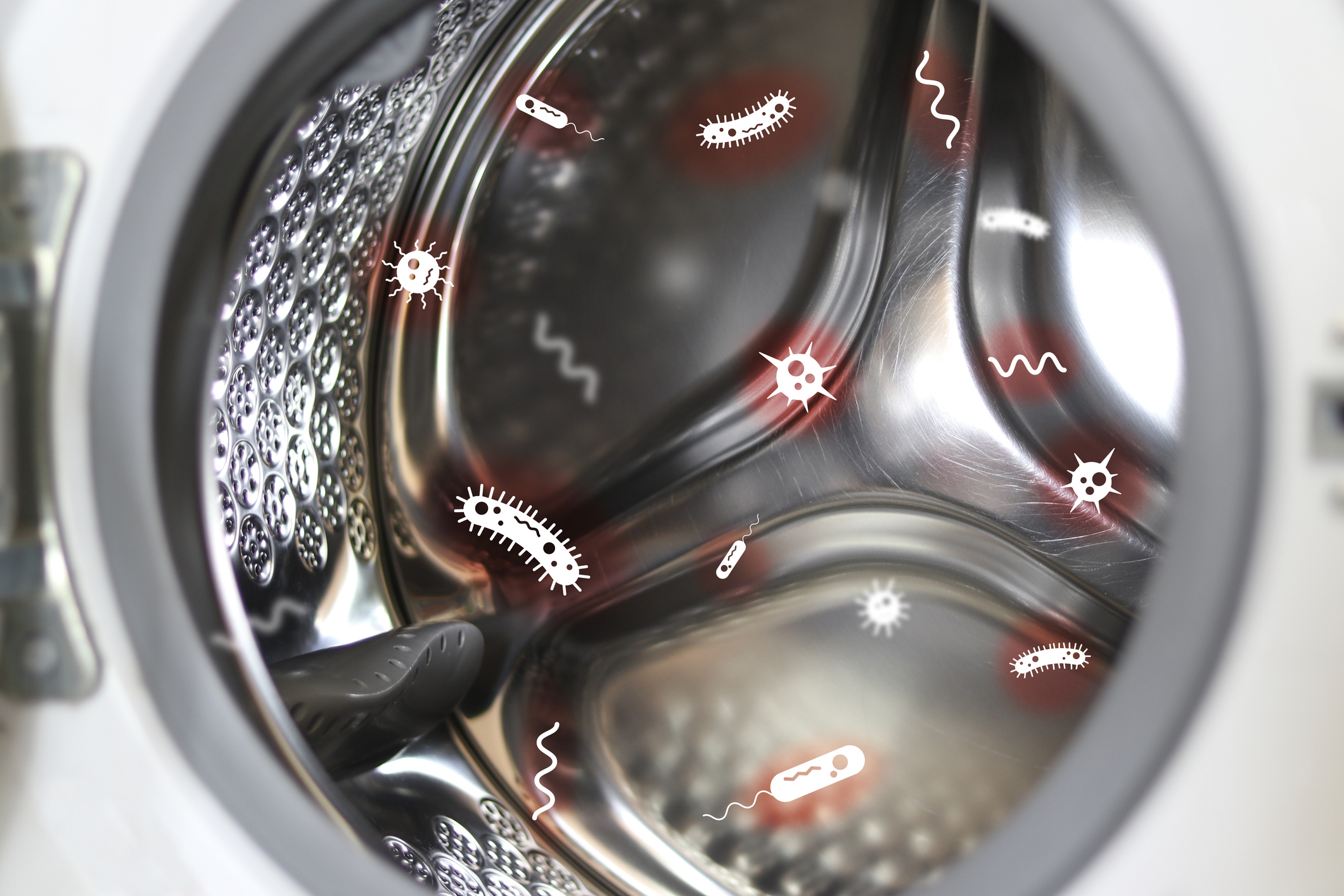 A graphic depicting germs on a front load washer drum 