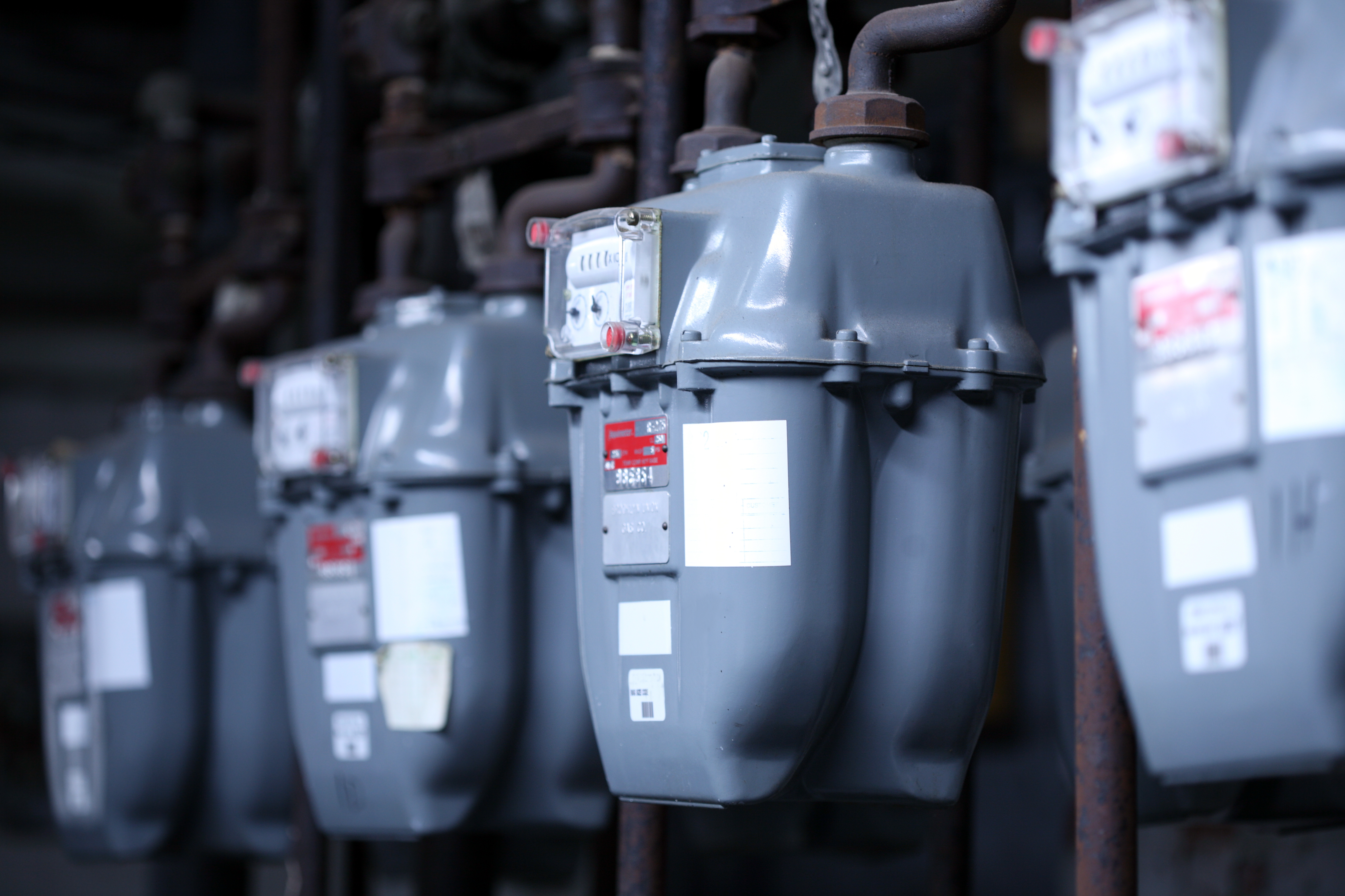 A lineup of home gas meters