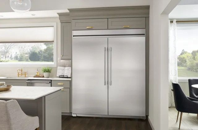 The Frigidaire Professional FPRU19F8WF column refrigerator with a matching freezer in a kitchen 