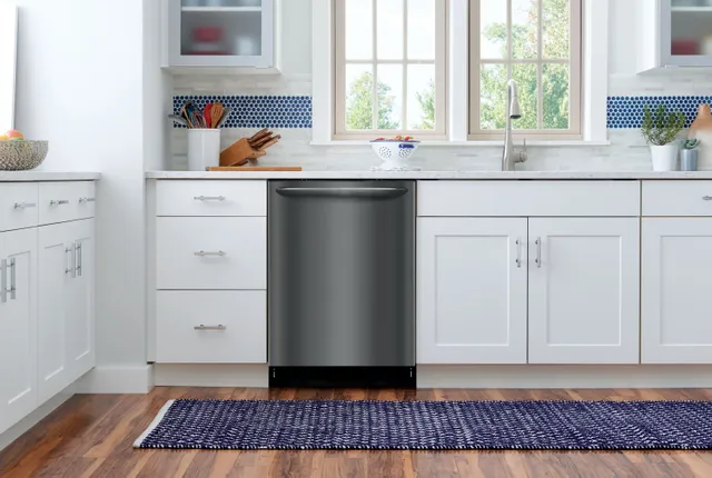 The Frigidaire Gallery FGID2468UD black stainless dishwasher featured in a modern kitchen 