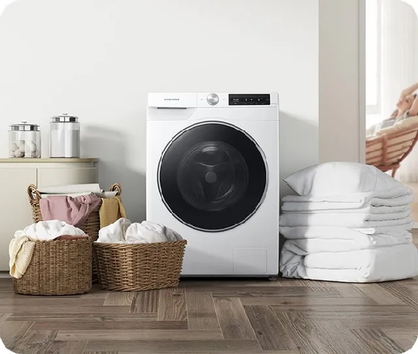The Samsung WW25B6900AW washer with laundry and laundry room items 